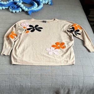 Chic Beige Sweater with Floral Accents